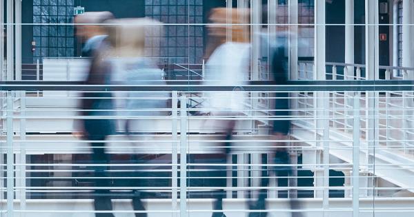 People walking quickly in a hallway